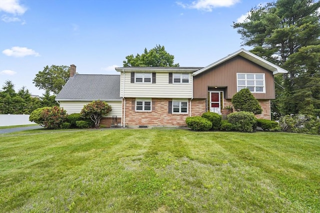 466 Hosmer St, Marlborough, MA 01752 - view of front of house featuring a chimney and brick siding