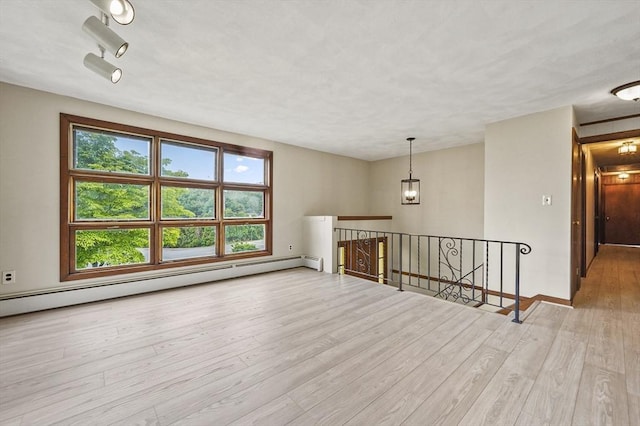 466 Hosmer St, Marlborough, MA 01752 - spare room featuring wood finished floors and baseboard heating