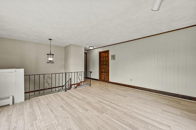 466 Hosmer St, Marlborough, MA 01752 - spare room featuring wood finished floors, a baseboard radiator, and a chandelier