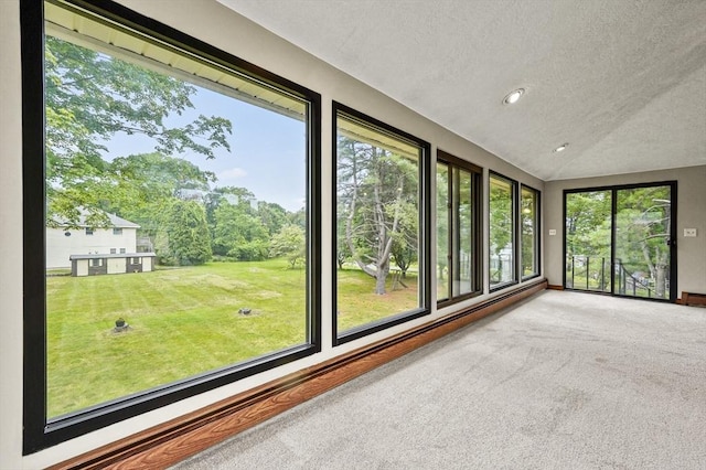 466 Hosmer St, Marlborough, MA 01752 - unfurnished sunroom featuring a textured ceiling, vaulted ceiling, plenty of natural light, carpet flooring, and recessed lighting