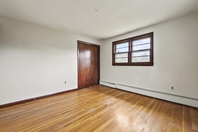 466 Hosmer St, Marlborough, MA 01752 - spare room featuring a baseboard radiator and light wood-style flooring
