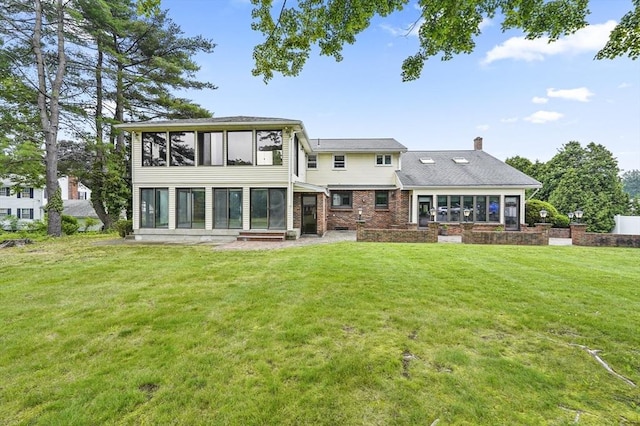 466 Hosmer St, Marlborough, MA 01752 - back of house with a sunroom, a chimney, a lawn, and brick siding