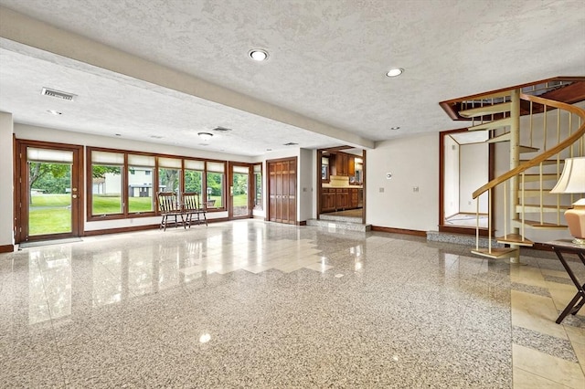 466 Hosmer St, Marlborough, MA 01752 - unfurnished living room with a textured ceiling, stairs, and recessed lighting