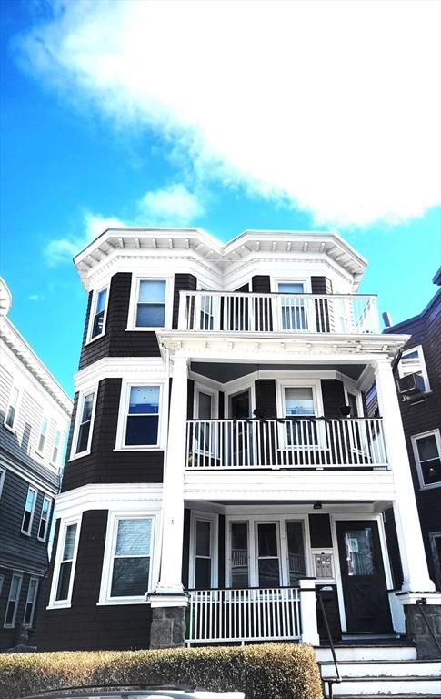 8 Dawes St, Boston, MA 02125 - view of front of house with a balcony