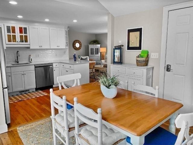 dining area featuring recessed lighting, visible vents, and light wood-style flooring