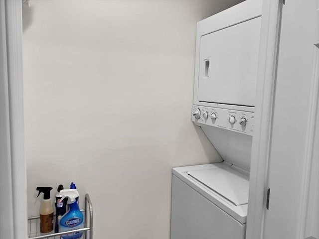 laundry area with stacked washing maching and dryer and laundry area