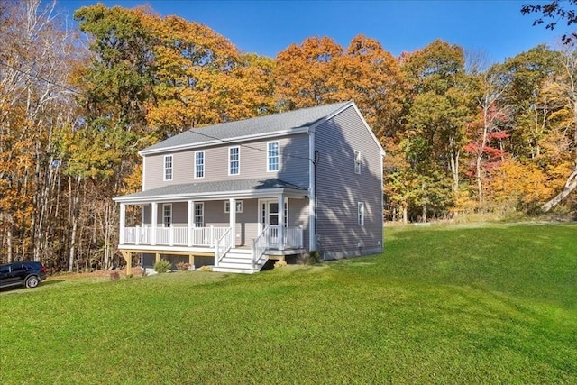 colonial home with covered porch and a front yard