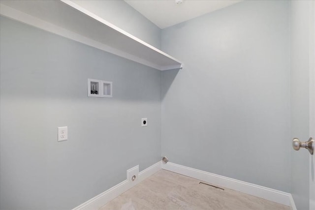 washroom with hookup for a washing machine, hookup for an electric dryer, laundry area, visible vents, and baseboards