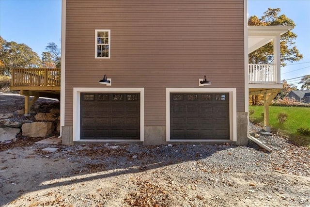 garage with gravel driveway