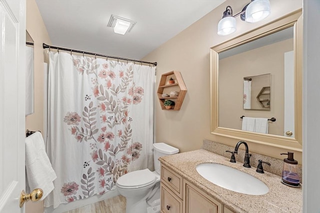 full bathroom featuring vanity, toilet, a shower with curtain, and visible vents