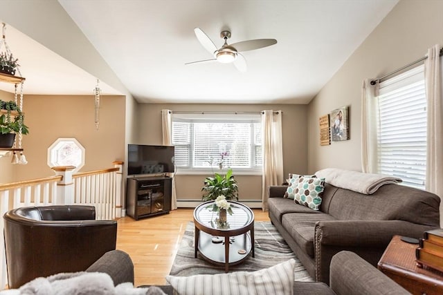 living room featuring a baseboard radiator, ceiling fan, wood finished floors, and lofted ceiling