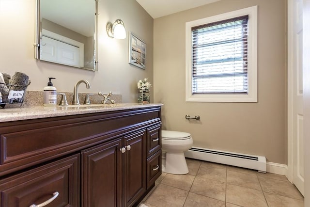 bathroom with vanity, a baseboard radiator, toilet, and tile patterned flooring