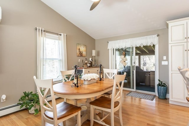 dining area featuring plenty of natural light, light wood-type flooring, ceiling fan, and lofted ceiling