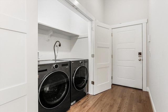 28 Main St Unit 4, Medford, MA 02155 - laundry area with washing machine and dryer and light wood-type flooring