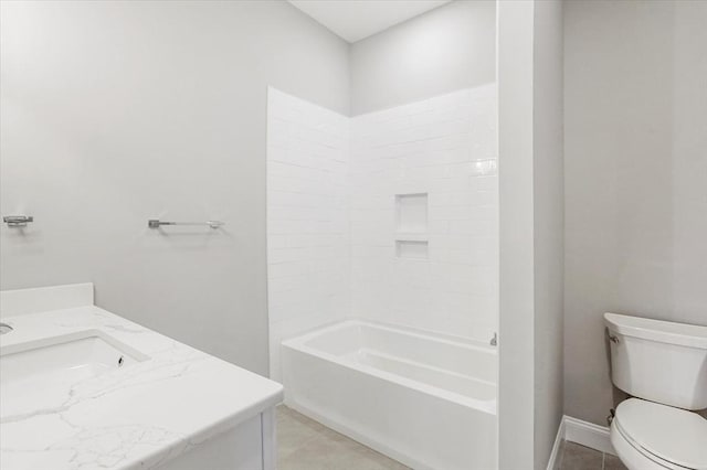 28 Main St Unit 4, Medford, MA 02155 - bathroom featuring vanity, toilet, tile patterned flooring, and washtub / shower combination