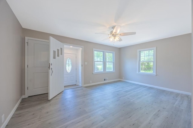 136 E St, South Hadley, MA 01075 - foyer entrance with light wood finished floors and a ceiling fan