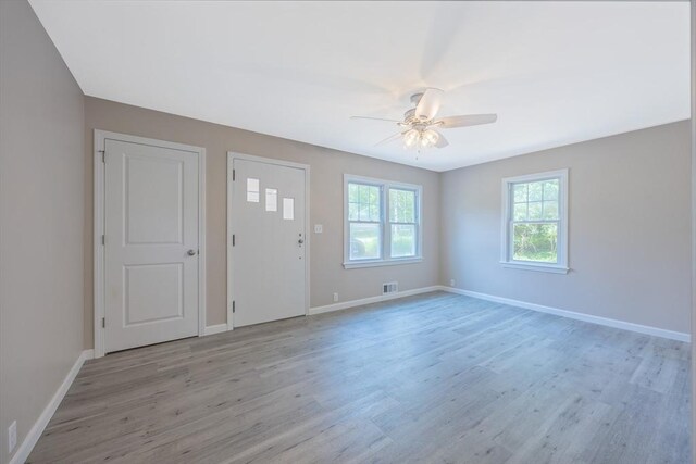 136 E St, South Hadley, MA 01075 - entrance foyer with light wood-style floors and ceiling fan