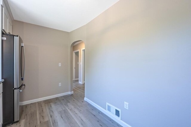 136 E St, South Hadley, MA 01075 - spare room with arched walkways and light wood-style floors