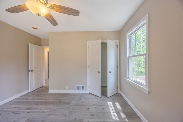136 E St, South Hadley, MA 01075 - unfurnished bedroom featuring light wood-style flooring and a ceiling fan