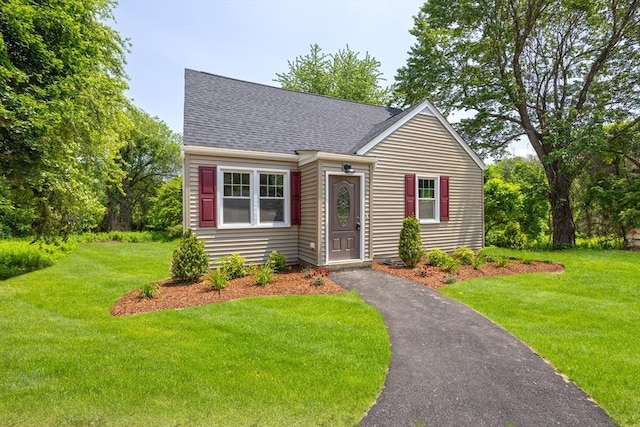 136 E St, South Hadley, MA 01075 - view of front facade with a front lawn and roof with shingles