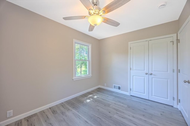 136 E St, South Hadley, MA 01075 - unfurnished bedroom with light wood-style flooring, a closet, and ceiling fan
