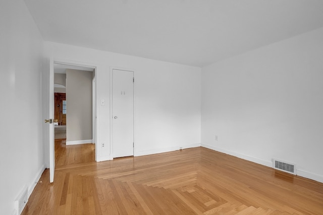 unfurnished room with parquet floors