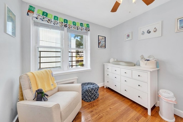 9 Twomey Ct Unit 52, Boston, MA 02127 - living area with ceiling fan and light wood-style floors