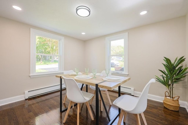 dining space with baseboard heating, wood finished floors, baseboards, plenty of natural light, and recessed lighting