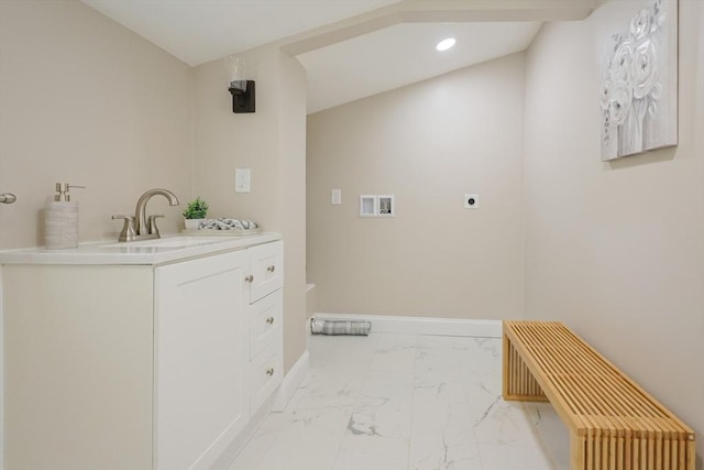 washroom featuring hookup for an electric dryer, hookup for a washing machine, light marble finish floors, recessed lighting, and baseboards