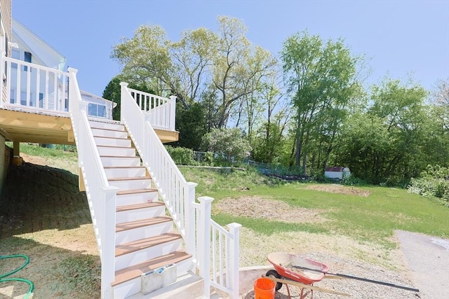 view of yard with stairs and a deck