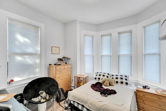 bedroom featuring a baseboard heating unit