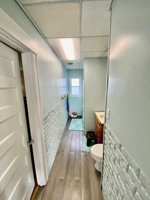1025 Main St, Worcester, MA 01603 - bathroom featuring vanity, wood finished floors, and a paneled ceiling