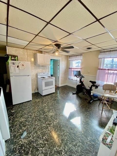 1025 Main St, Worcester, MA 01603 - kitchen with white appliances, a drop ceiling, a ceiling fan, and white cabinetry