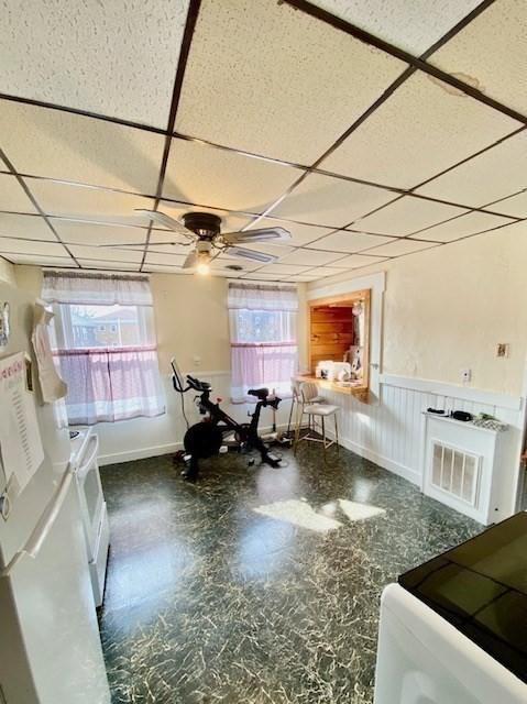 1025 Main St, Worcester, MA 01603 - dining area featuring a drop ceiling, wainscoting, and a ceiling fan