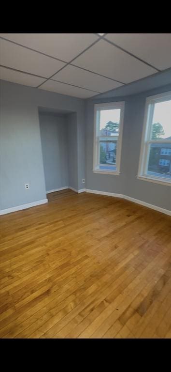 1025 Main St, Worcester, MA 01603 - spare room featuring baseboards and light wood finished floors