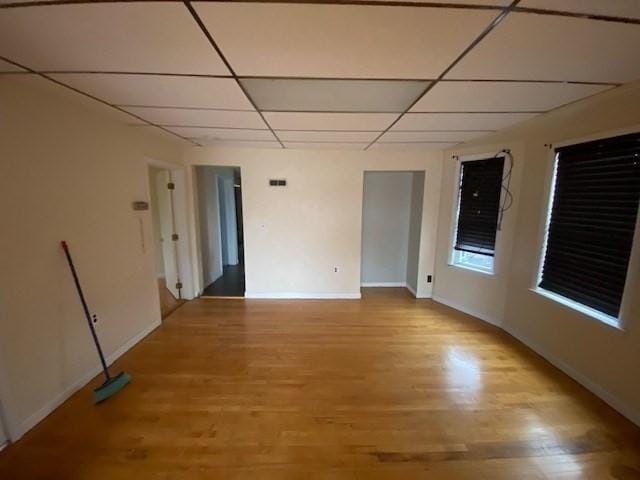 1025 Main St, Worcester, MA 01603 - empty room featuring a paneled ceiling and light wood finished floors