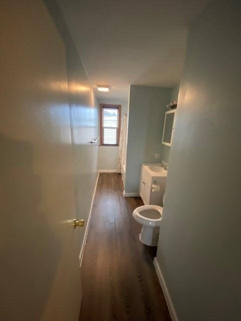 1025 Main St, Worcester, MA 01603 - hall featuring dark wood finished floors and baseboards