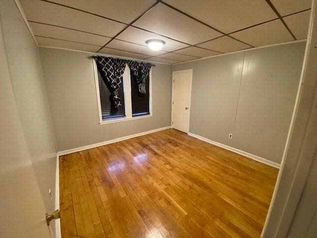 1025 Main St, Worcester, MA 01603 - unfurnished room with a paneled ceiling and wood finished floors