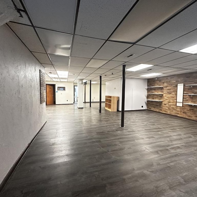 1025 Main St, Worcester, MA 01603 - finished basement with wood walls, wood finished floors, and a drop ceiling
