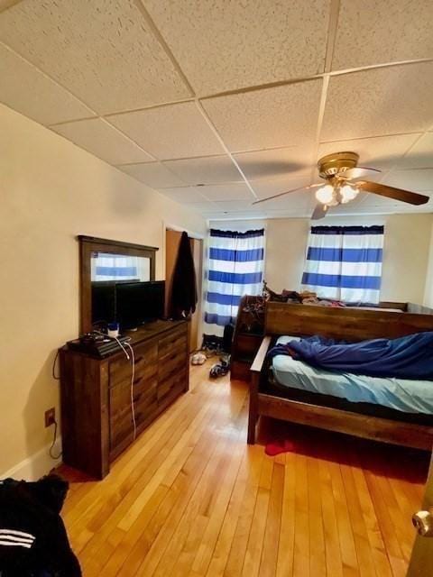 1025 Main St, Worcester, MA 01603 - bedroom featuring a paneled ceiling, light wood finished floors, and a ceiling fan