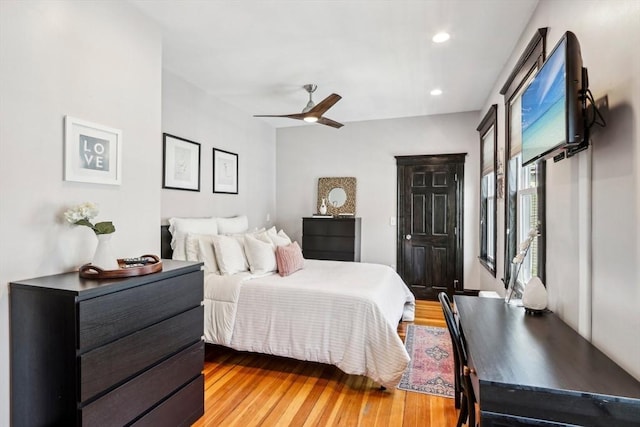 bedroom with ceiling fan, light wood-style flooring, and recessed lighting