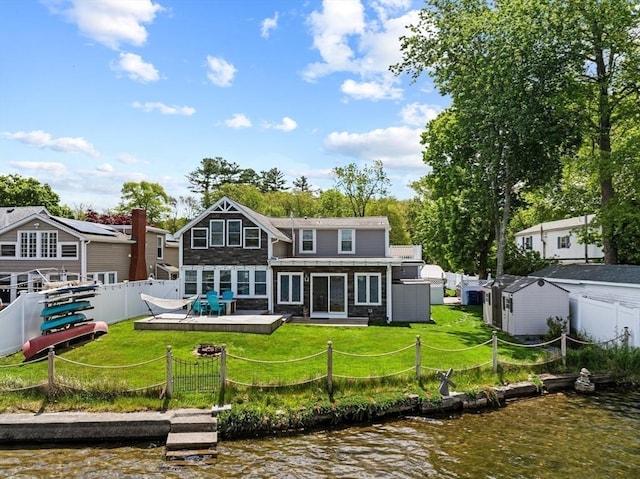 1091 Tobey St, New Bedford, MA 02745 - rear view of property featuring a deck with water view and stone siding