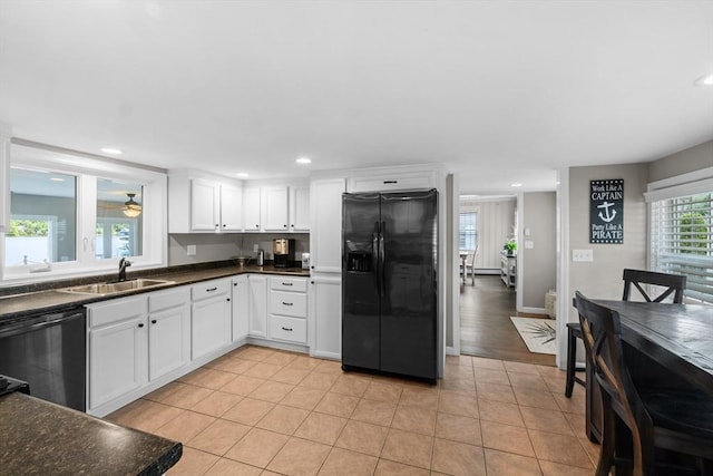 1091 Tobey St, New Bedford, MA 02745 - kitchen featuring black appliances, a sink, dark countertops, white cabinetry, and recessed lighting