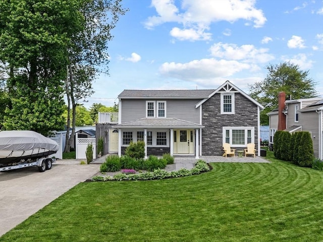 1091 Tobey St, New Bedford, MA 02745 - view of front of home with stone siding and concrete driveway