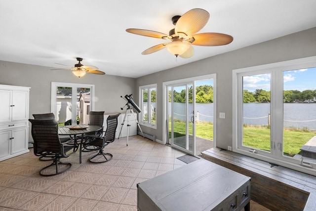 1091 Tobey St, New Bedford, MA 02745 - sunroom / solarium featuring a baseboard radiator, french doors, and a water view