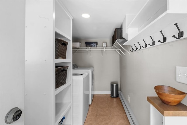 1091 Tobey St, New Bedford, MA 02745 - laundry room with a baseboard heating unit, independent washer and dryer, light tile patterned floors, and baseboards
