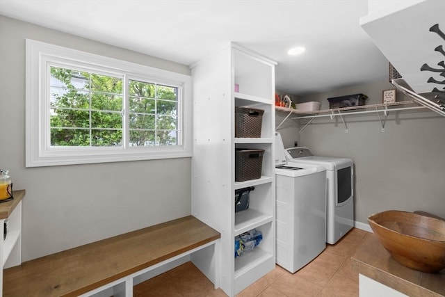 1091 Tobey St, New Bedford, MA 02745 - laundry room with independent washer and dryer and light tile patterned floors