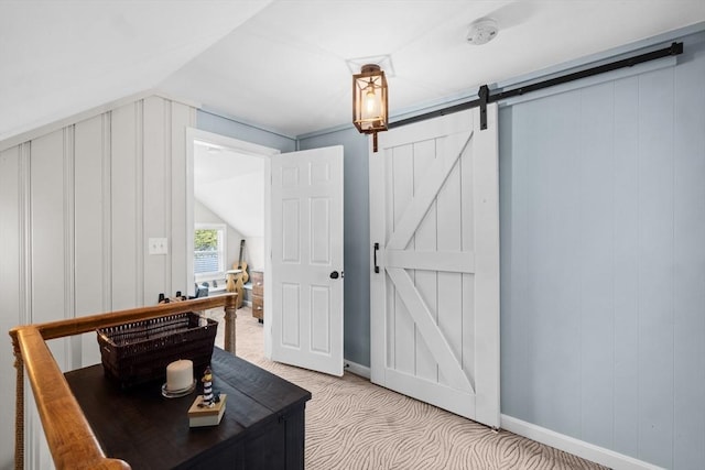1091 Tobey St, New Bedford, MA 02745 - office space with a barn door, light carpet, vaulted ceiling, and baseboards