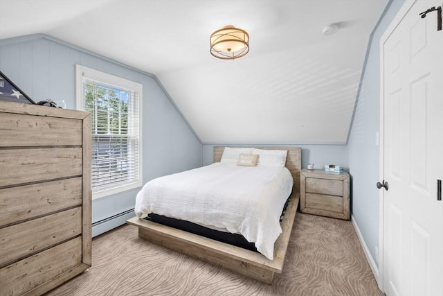1091 Tobey St, New Bedford, MA 02745 - carpeted bedroom featuring a baseboard heating unit, lofted ceiling, and baseboards