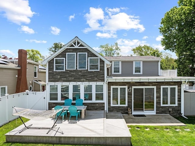 1091 Tobey St, New Bedford, MA 02745 - rear view of house featuring a wooden deck, a gate, and stone siding